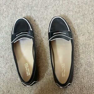 Michael Kors loafer.  Black with white trim. Size 7